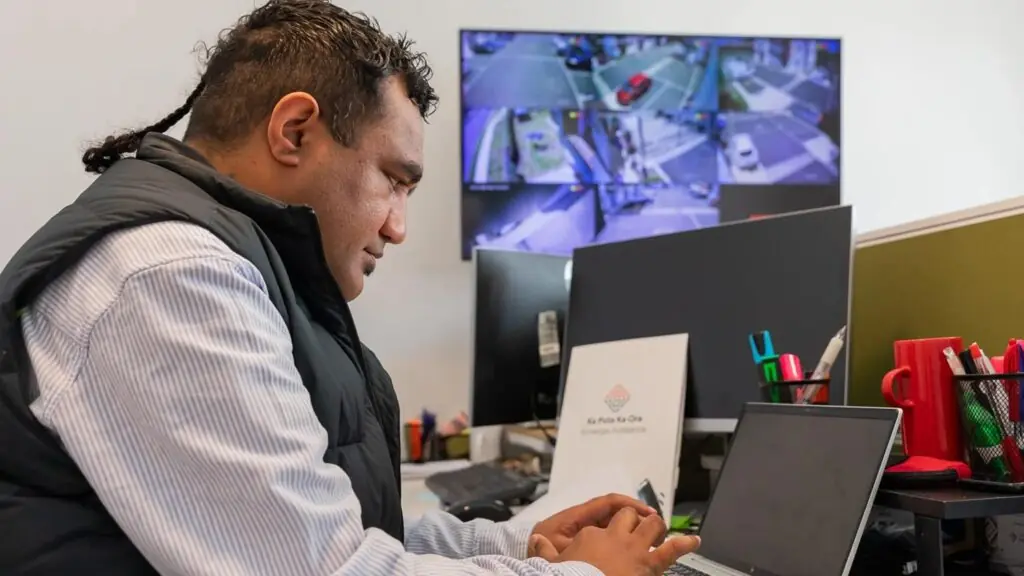 man sitting at laptop